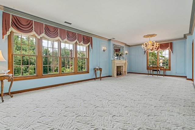 unfurnished living room with carpet floors and a chandelier