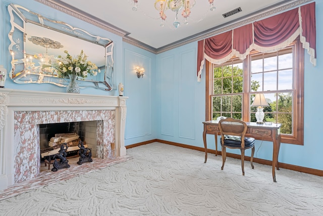 office area with a fireplace, ornamental molding, and light carpet