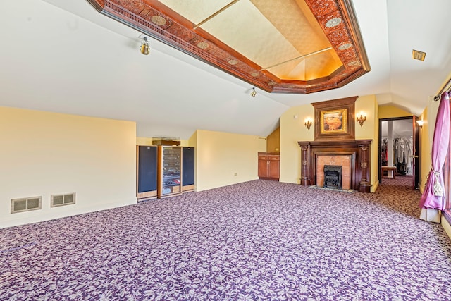 unfurnished living room featuring carpet and lofted ceiling