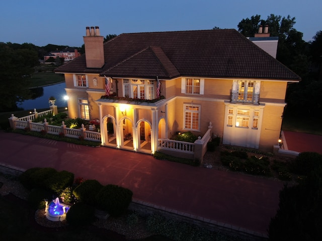 view of front of house featuring a balcony