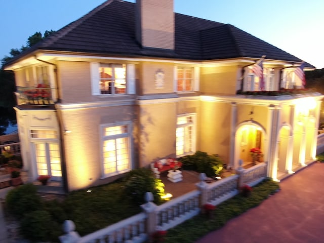 view of front of house featuring a balcony