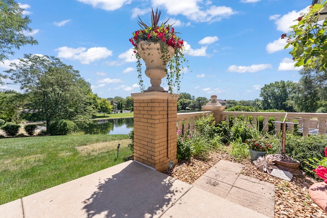 view of patio with a water view