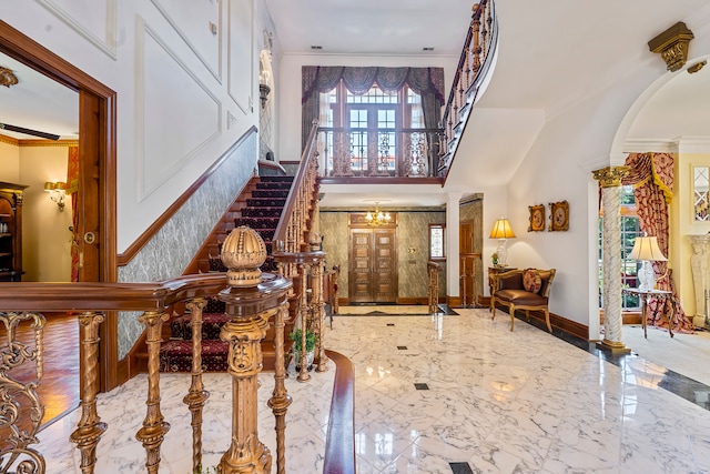 foyer featuring crown molding