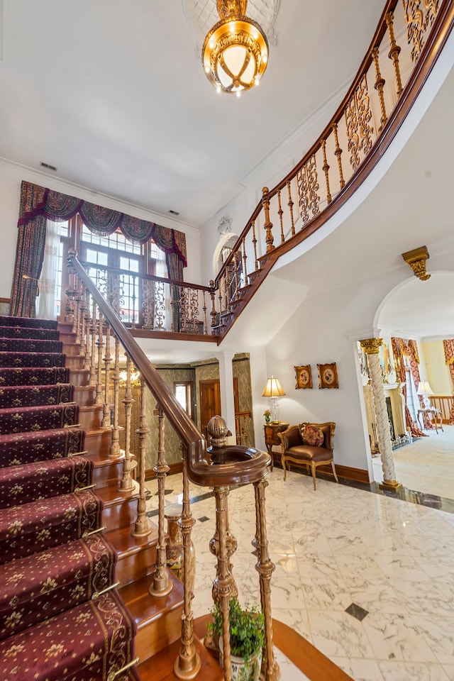 stairs featuring crown molding