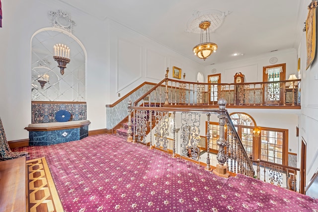 living room featuring a notable chandelier and crown molding