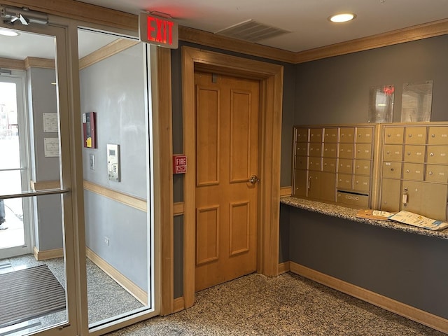 interior space featuring crown molding and mail boxes