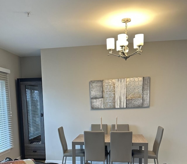 dining area featuring a chandelier