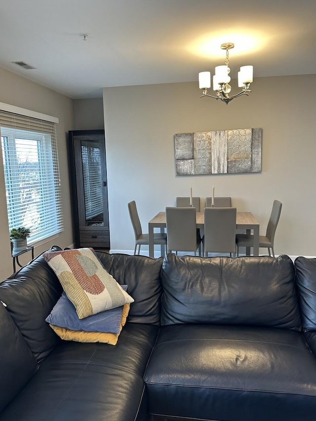 living room featuring an inviting chandelier