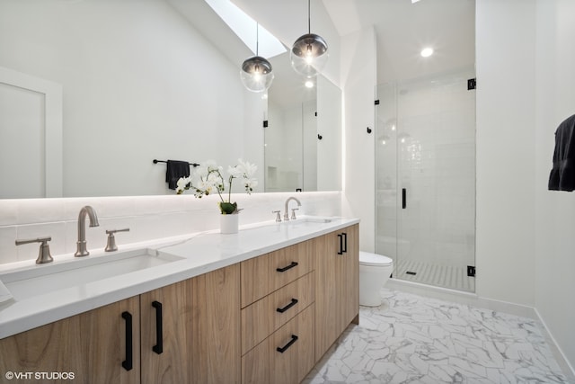 bathroom featuring walk in shower, tile floors, lofted ceiling with skylight, toilet, and double vanity