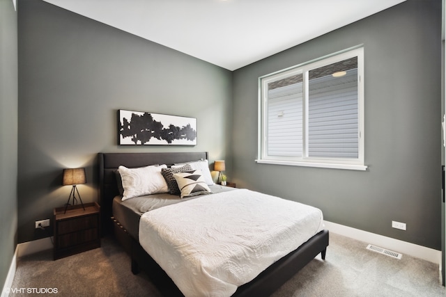 bedroom with dark carpet