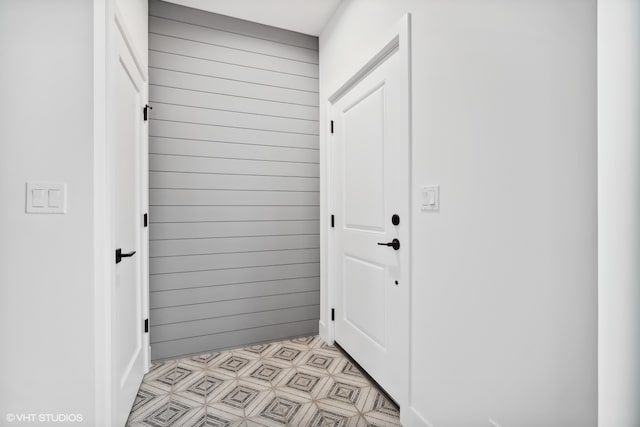 doorway featuring light tile flooring