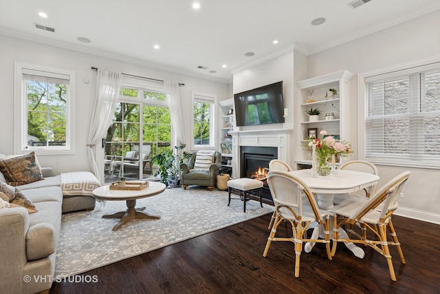 2732 N Seminary Ave Unit 3, Chicago, IL 60614 - living area featuring a glass covered fireplace, dark wood-style floors, crown molding, recessed lighting, and baseboards