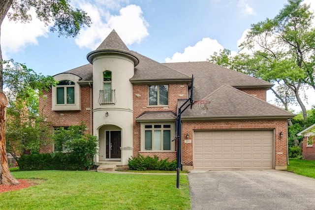 view of front of property with a front lawn and a garage