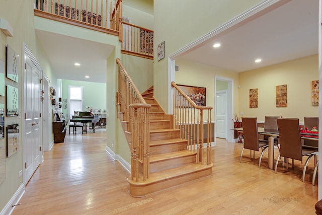 stairway featuring light hardwood / wood-style flooring