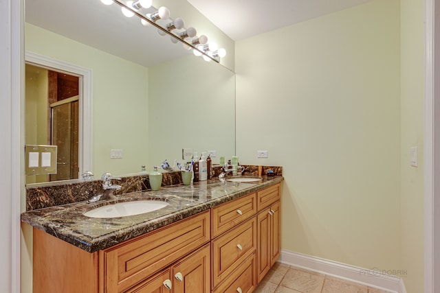 bathroom featuring dual vanity and tile floors