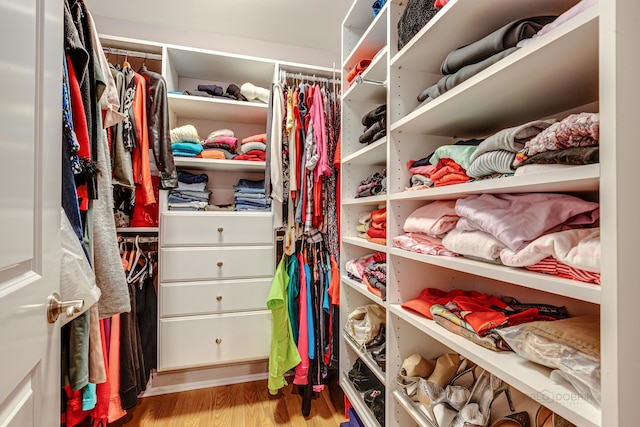 spacious closet with light hardwood / wood-style floors