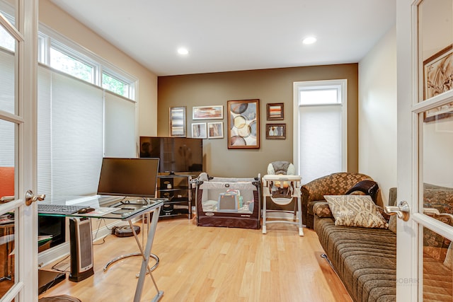 office featuring light hardwood / wood-style floors and french doors