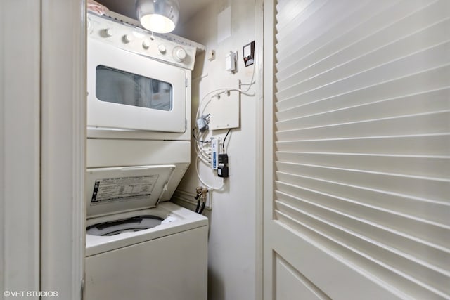 laundry area with stacked washing maching and dryer