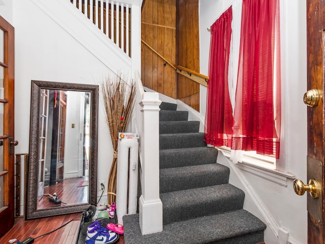 staircase featuring wood-type flooring