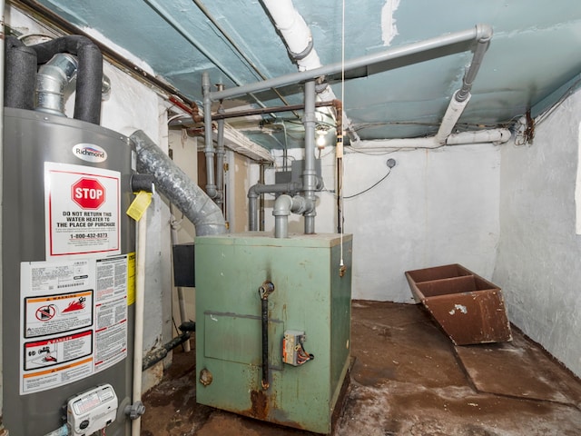 utility room featuring water heater