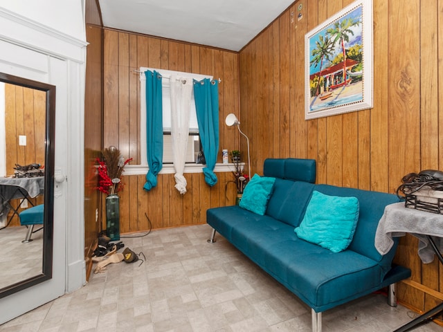 living area with wood walls and light tile floors