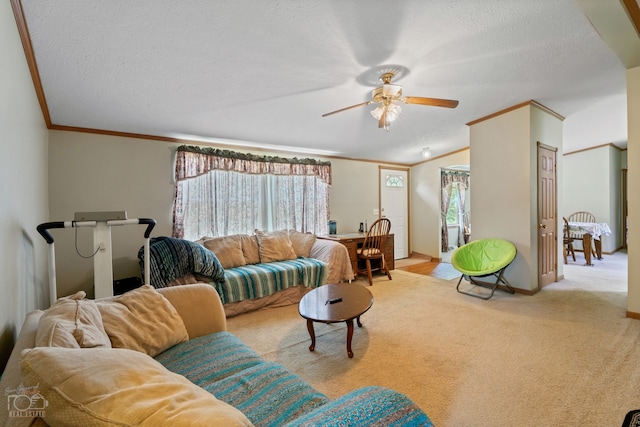 living room with light carpet, a textured ceiling, crown molding, and ceiling fan