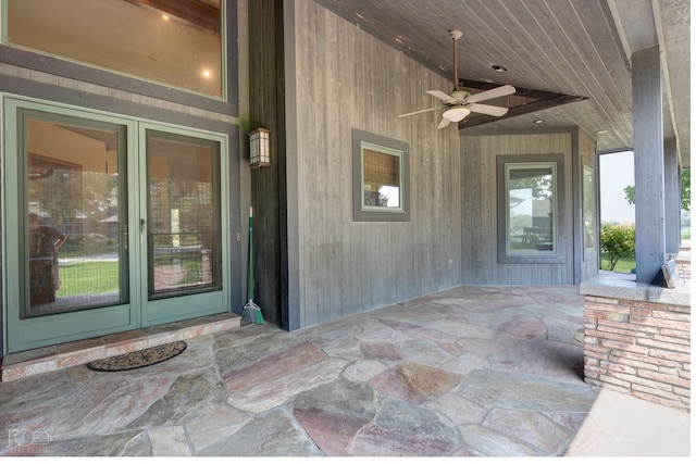 entrance to property featuring french doors and ceiling fan