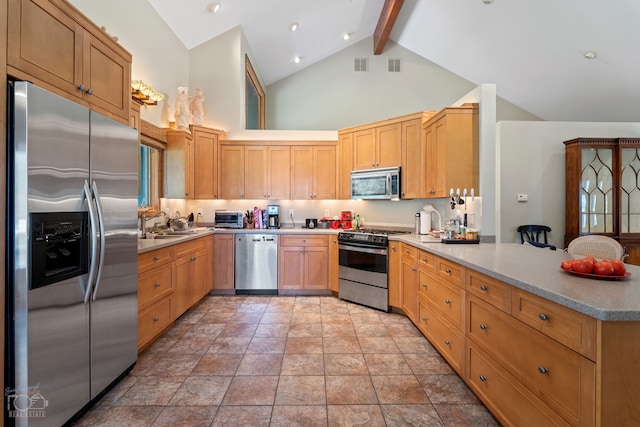 kitchen with appliances with stainless steel finishes, light tile flooring, beam ceiling, sink, and high vaulted ceiling