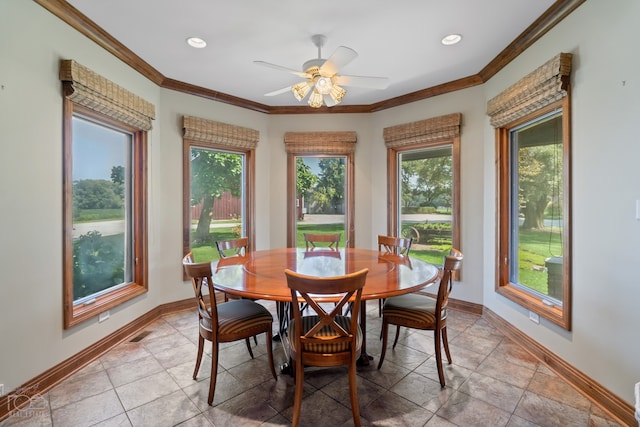 tiled dining room with ceiling fan, crown molding, and plenty of natural light