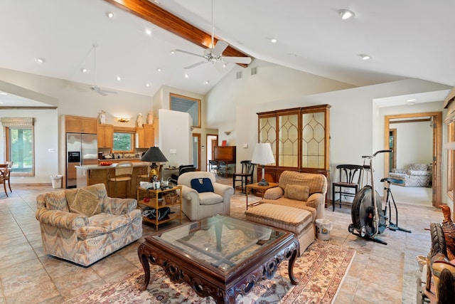 tiled living room with high vaulted ceiling, ceiling fan, and beamed ceiling