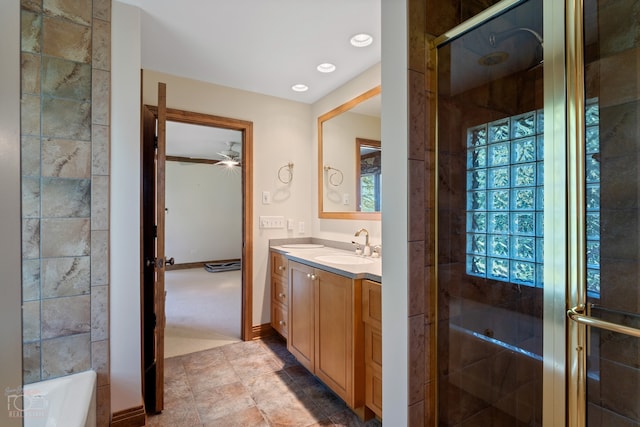 bathroom featuring a bath, dual vanity, tile floors, and ceiling fan