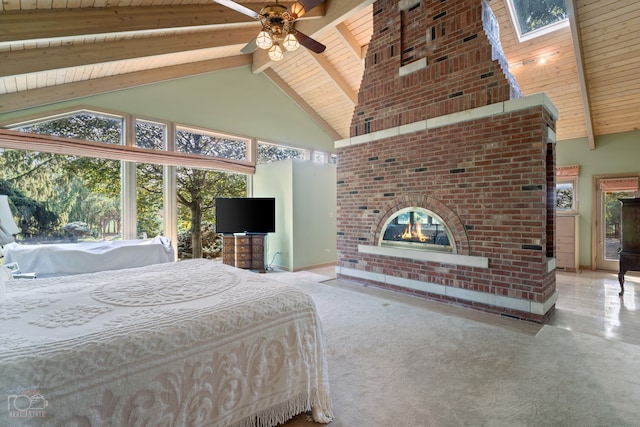 carpeted bedroom featuring high vaulted ceiling, wood ceiling, a skylight, and beamed ceiling