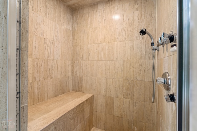 bathroom with a tile shower