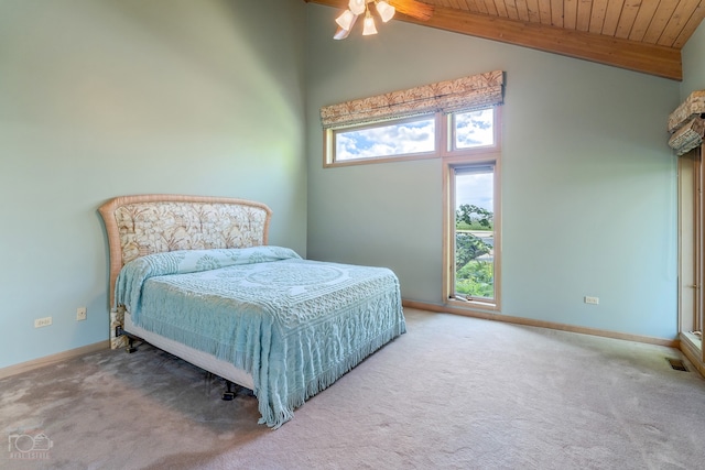 bedroom featuring ceiling fan, wood ceiling, light colored carpet, and high vaulted ceiling