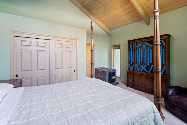 carpeted bedroom featuring a closet, vaulted ceiling with beams, and wood ceiling