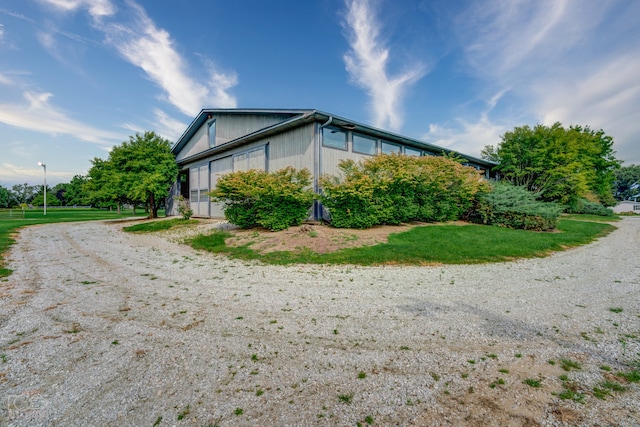 view of home's exterior with a lawn