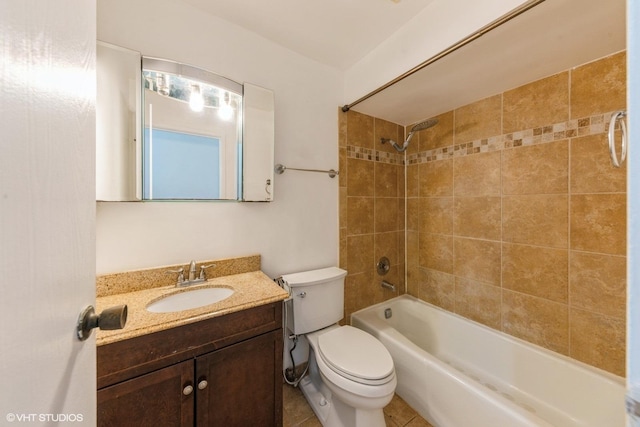 bathroom featuring shower / bathing tub combination, vanity, toilet, and tile patterned flooring