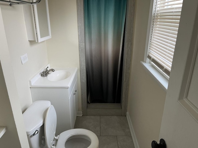 bathroom featuring toilet, tile patterned floors, a shower with shower curtain, and vanity