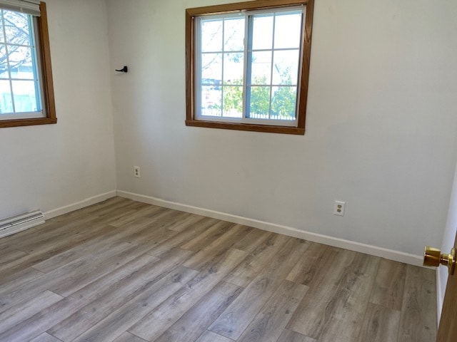 unfurnished room featuring light wood-type flooring