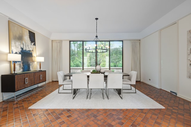 dining space featuring a chandelier