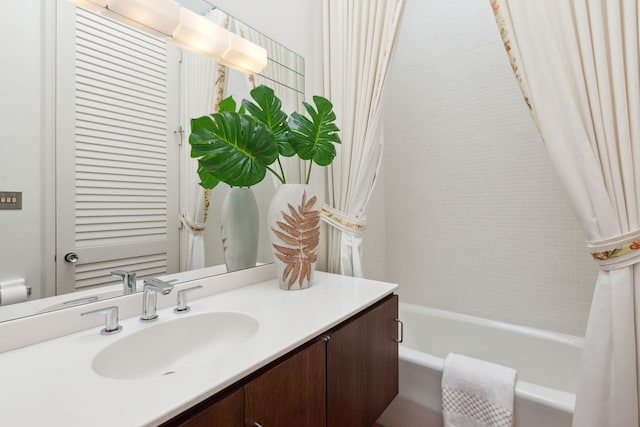 full bathroom with vanity, toilet, and shower / tub combo with curtain