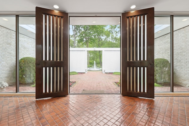 doorway with dark tile patterned flooring