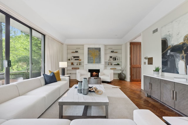 living room featuring dark parquet floors