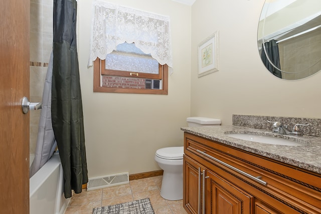 full bathroom with vanity, toilet, tile patterned floors, and shower / bath combo with shower curtain