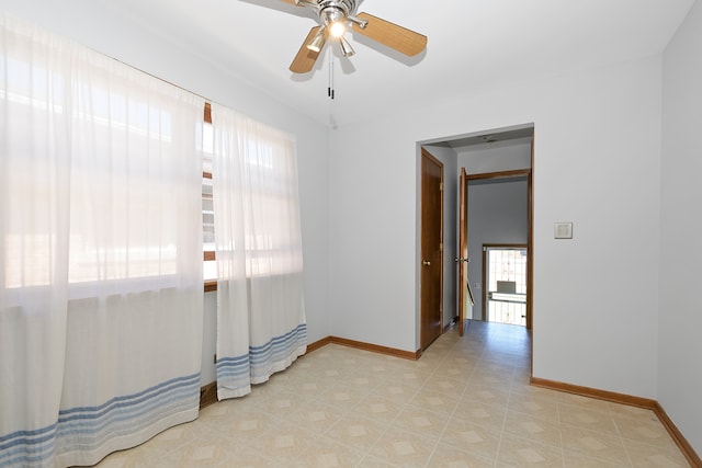 spare room with ceiling fan