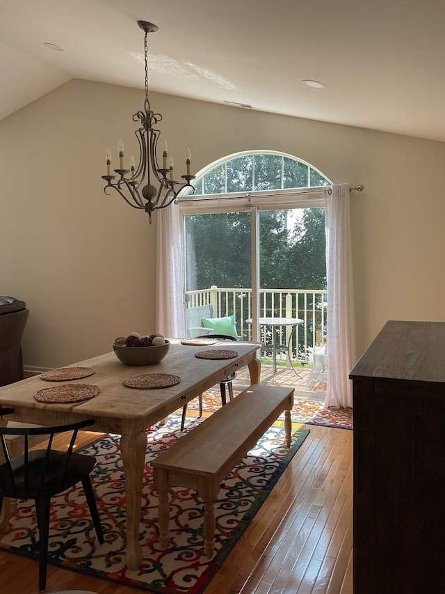 5203 Glenbrook Trl, Mchenry, IL 60050 - dining space with hardwood / wood-style floors, a chandelier, and lofted ceiling