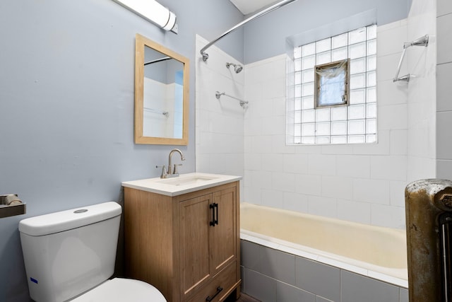 full bathroom with vanity, toilet, and tiled shower / bath combo