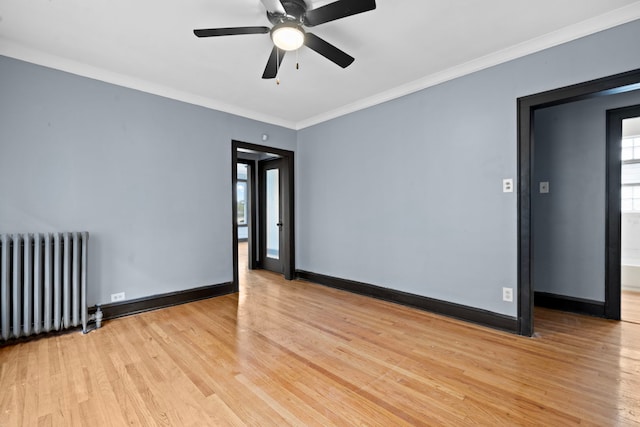 unfurnished room with crown molding, light hardwood / wood-style floors, radiator heating unit, and ceiling fan