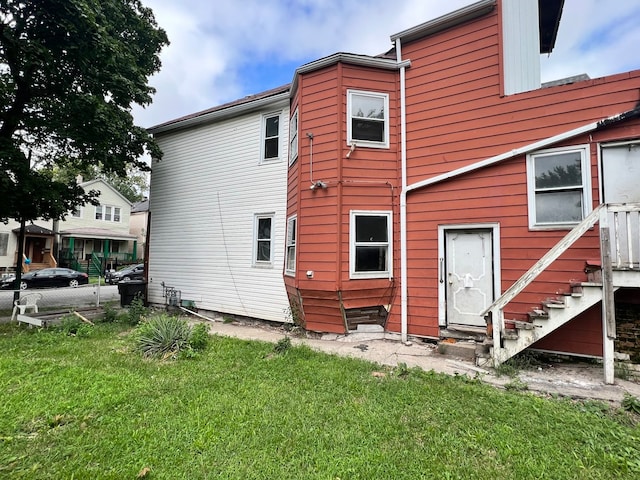 rear view of house with a lawn