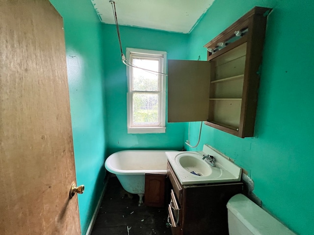 bathroom featuring toilet and vanity